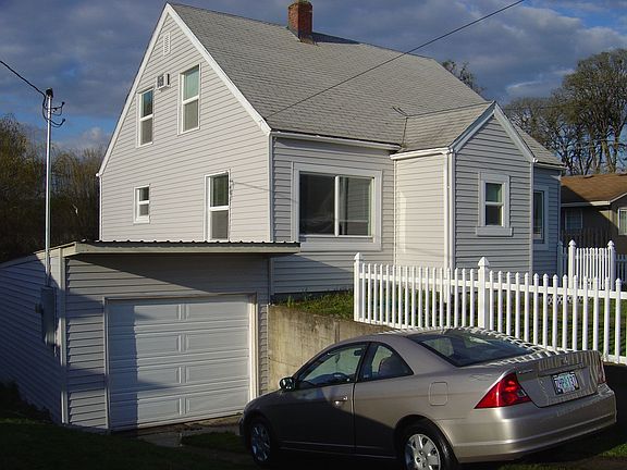 Side-front view. Attached garage.