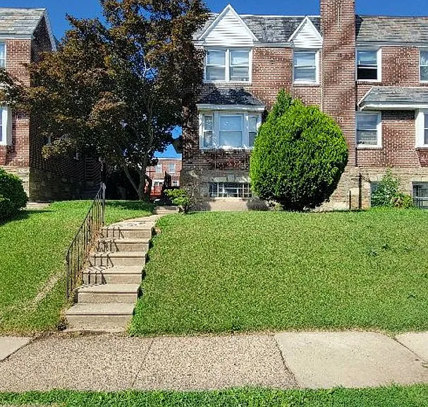 7703 Woolston Ave — Photo 1