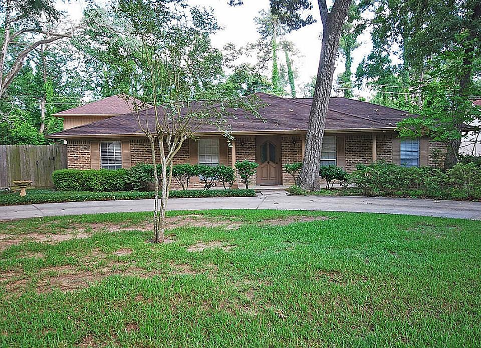 Spacious 1 story on beautifully treed lot.