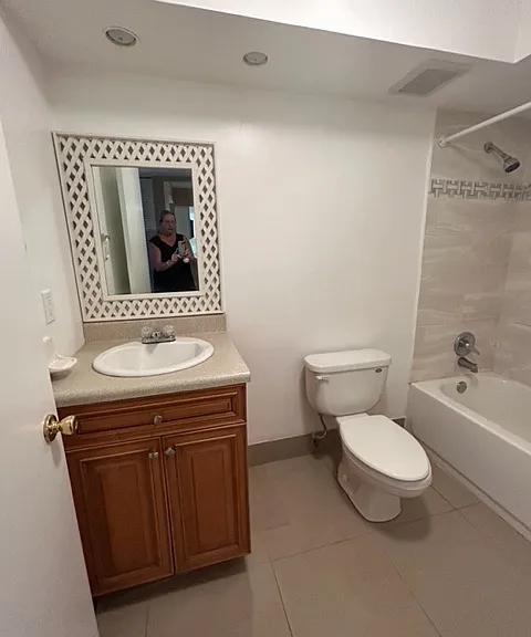 bathroom with tub and shower