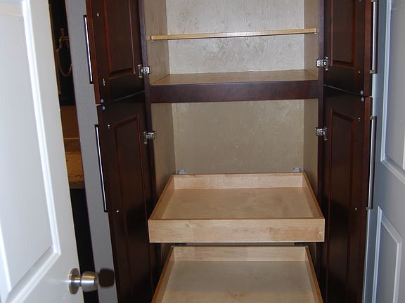 Linen closet with pull out drawers