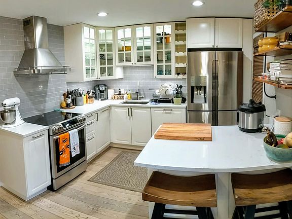 Fully renovated kitchen with top end finishes and recessed lighting