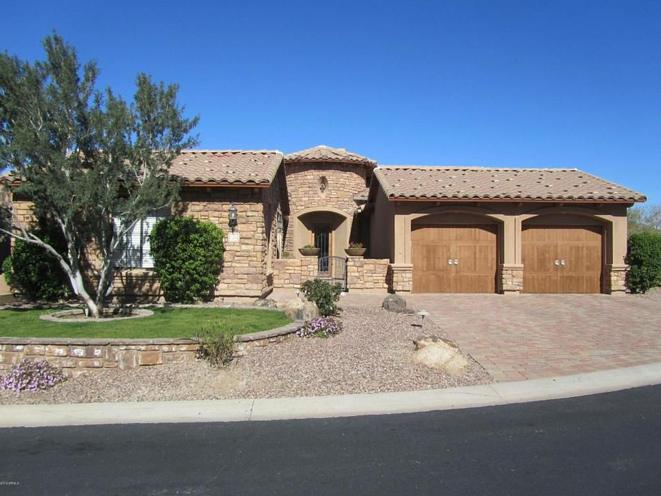 Tuscan style architecture with double garage