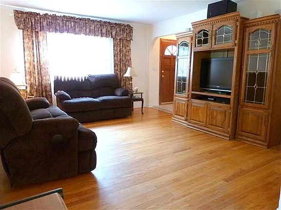 View of Entrance way and Living Room before mounting TV on wall