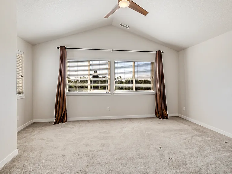 Master bedroom with great views and high vaulted ceiling.
