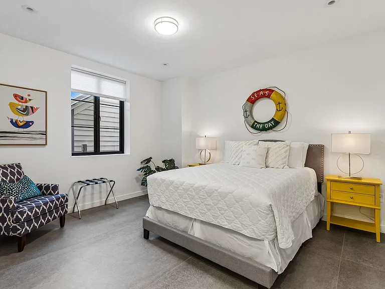 Queen size bed in downstairs guest suite