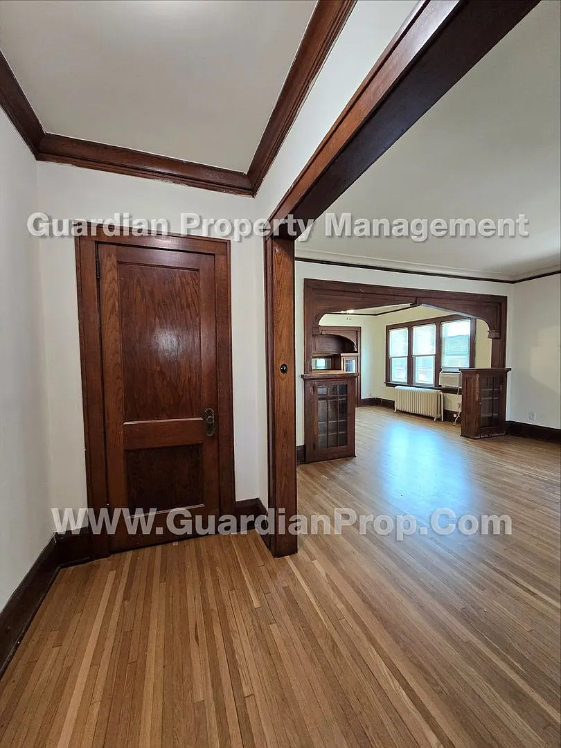Large main floor duplex unit, Updated Kitchen & Bath, Full Dining Room w/Built-ins + Sunroom, gar... — Photo 2