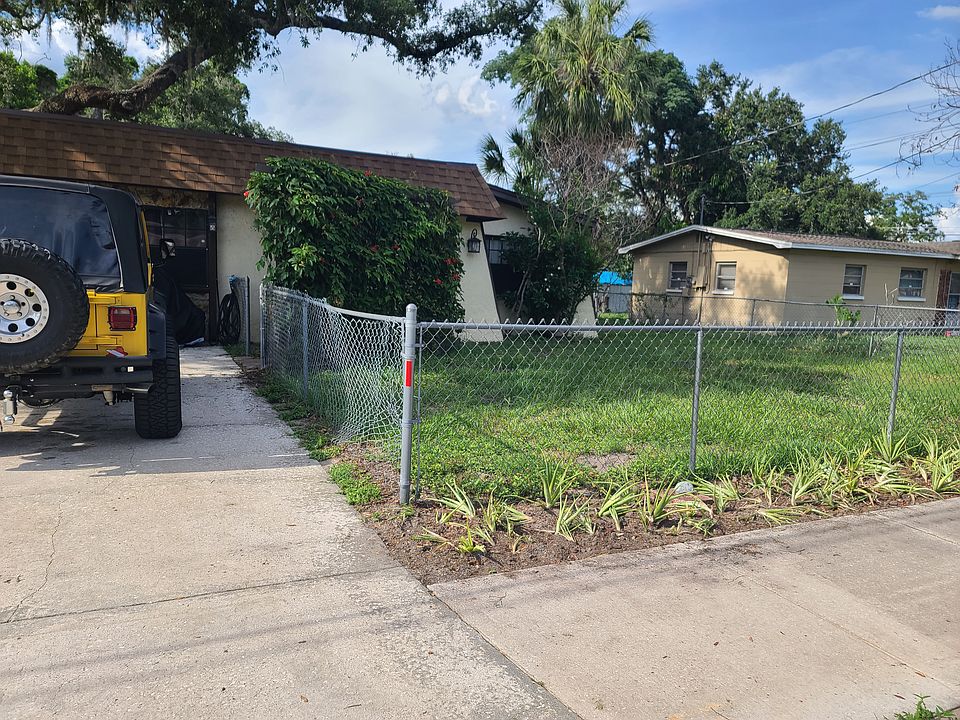 Front yard with passion flower vine covered patio
