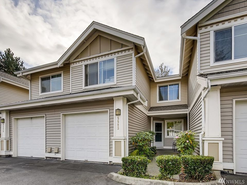 The garage to the left of the front door belongs to the home and has access from inside.
