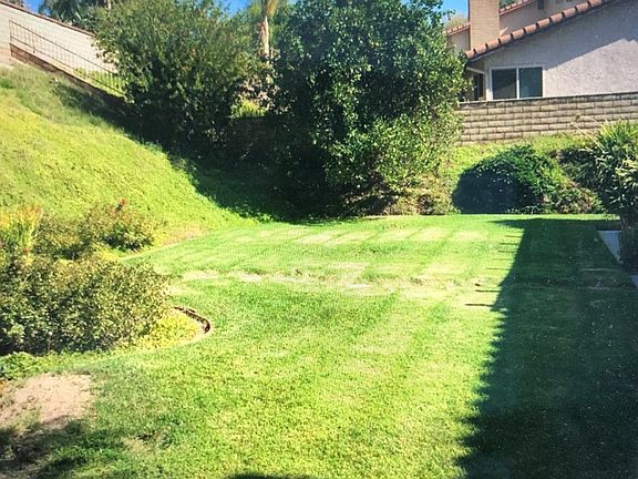 View from kitchen window and Master bathroom.
