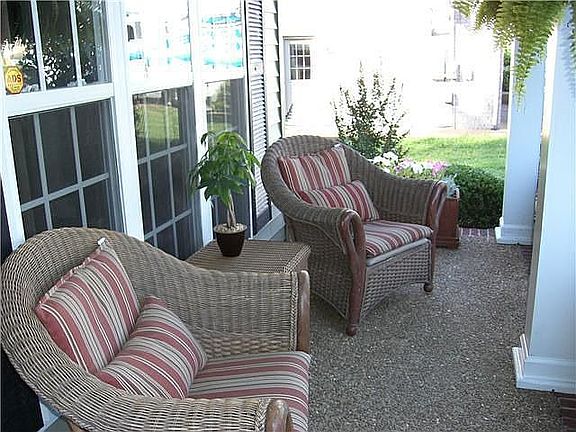 This inviting front porch welcomes you in.