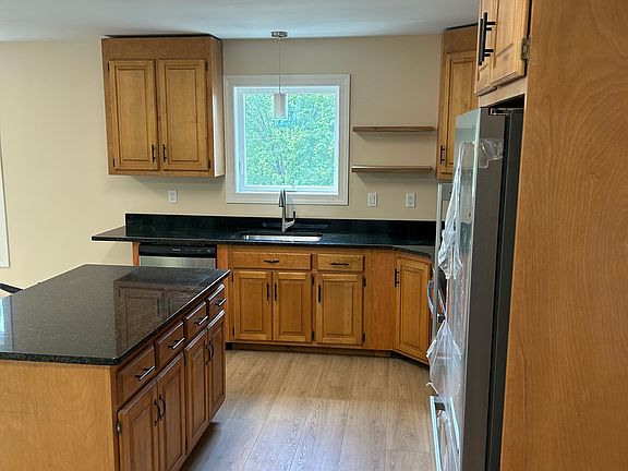 Lots of storage; island has (4) drawers and full cabinets below. Also has a granite overhang to accommodate seating on opposite side.
