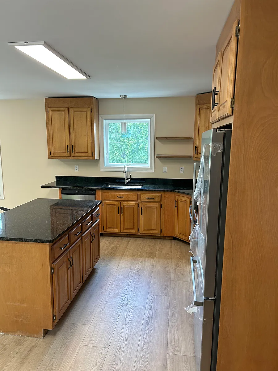 Lots of storage; island has (4) drawers and full cabinets below. Also has a granite overhang to accommodate seating on opposite side. - 207 Burton St #2ND FLR