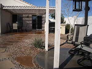 Sitting area in backyard by pond