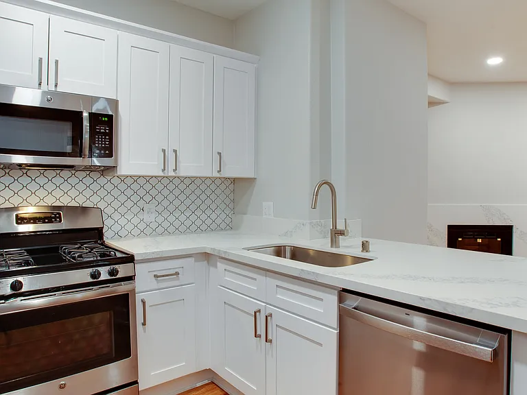 Select kitchens offer stainless steel appliances and quartz countertops