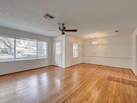 Loads of natural light with large windows. Dining area open to living area.