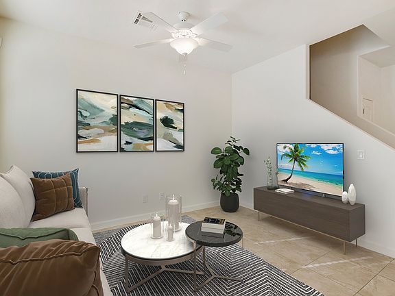 Living Room adjacent to dining area and kitchen for a more family friendly space