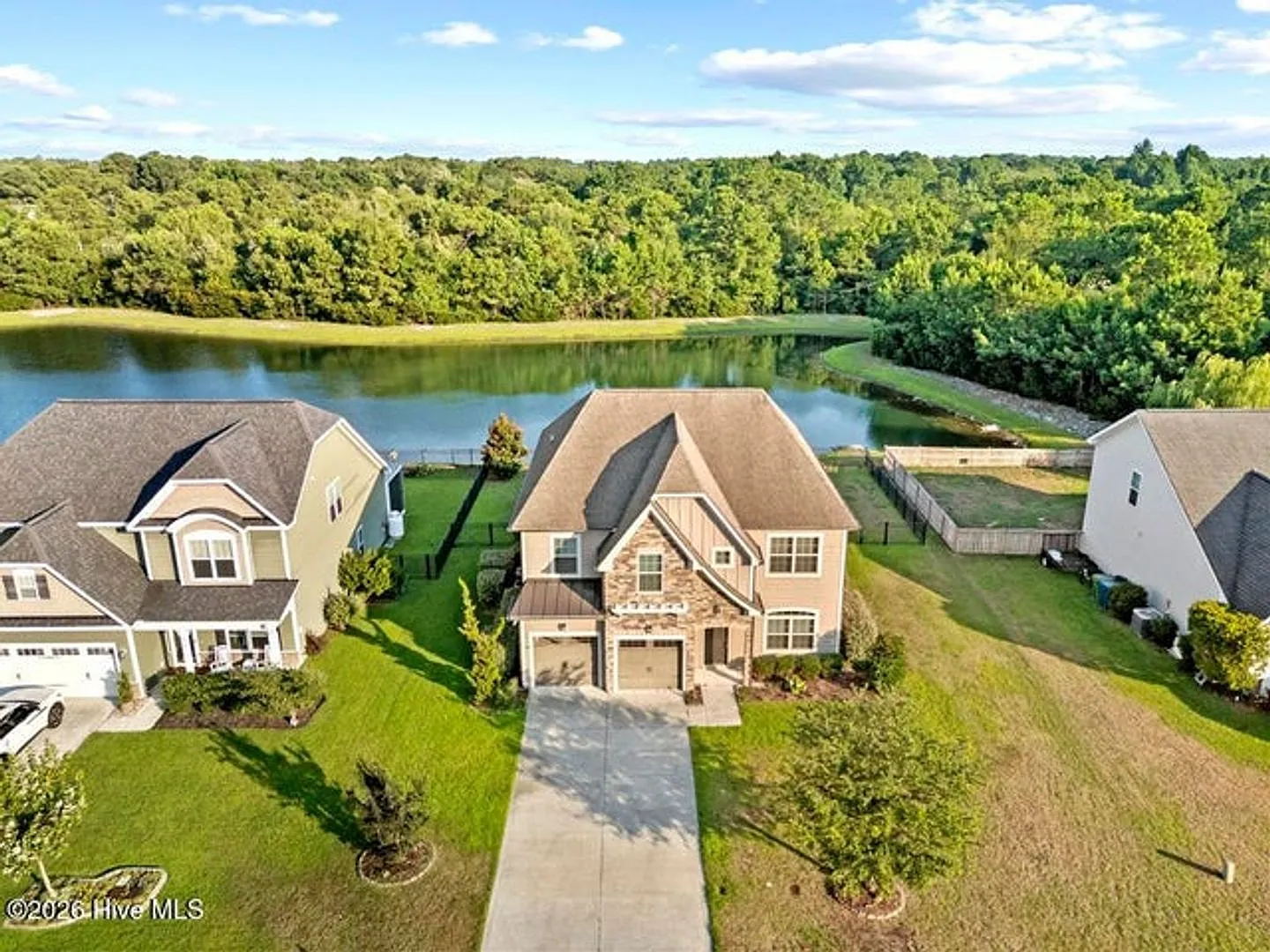 Set along a peaceful pond in the gated community of Mimosa Bay — Photo 3