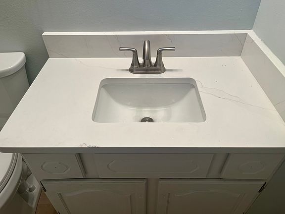 En Suite master bathroom with quartz vanity
