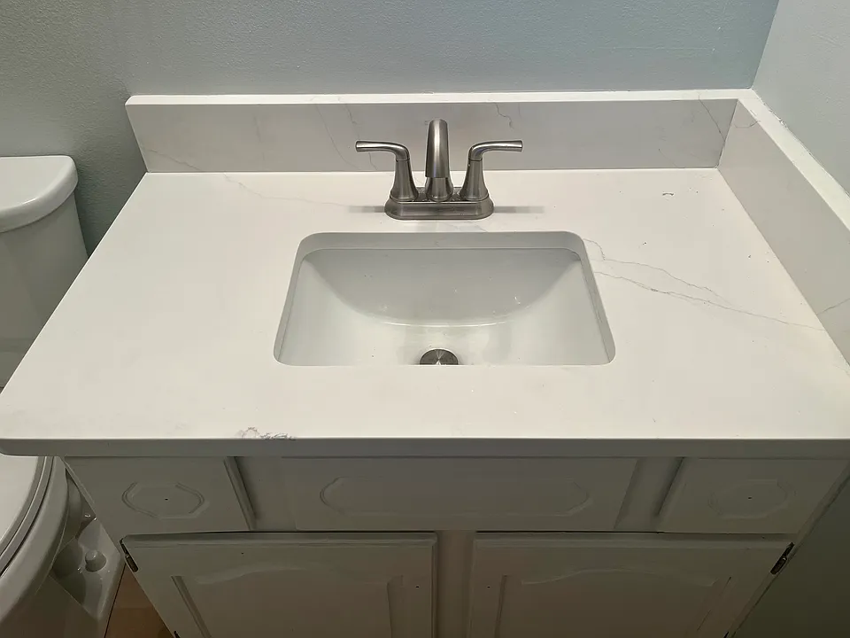 En Suite master bathroom with quartz vanity