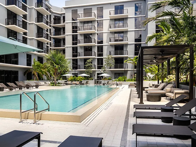 Resort-style pool with sundeck and cabanas