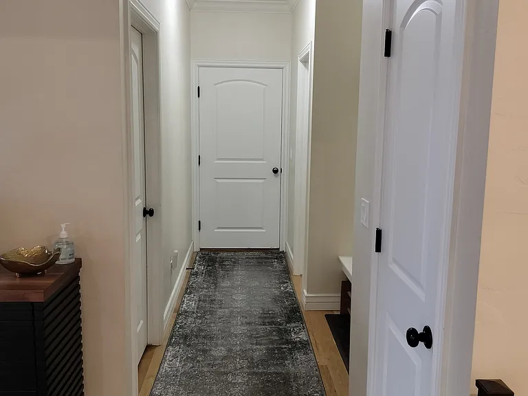 Laundry room with new LG washer/dryer (20+ settings), ample counters, and cabinets for organization. Conveniently located by the garage, with benches, a coat rack, and a half bath_perfect for managing outdoor gear and storage needs.