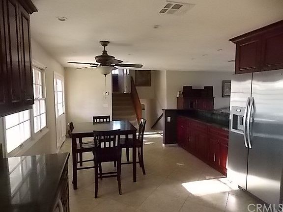 View from kitchen to front entry and stair area.
