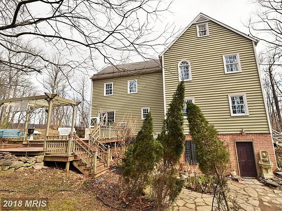 Rear of Home with Deck and Patio