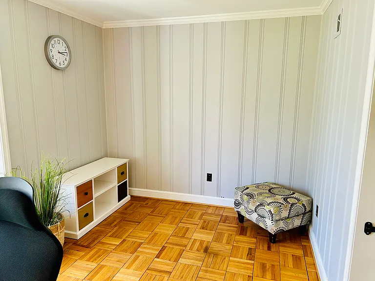 A fourth bedroom/den is filled with sunlight and opens directly to the living room. Currently set up as a home office. Also perfect as a kid's room, formal dining room, or family room.
