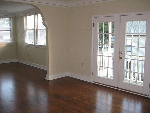 Dining room with doors to balcony and living room on the left
