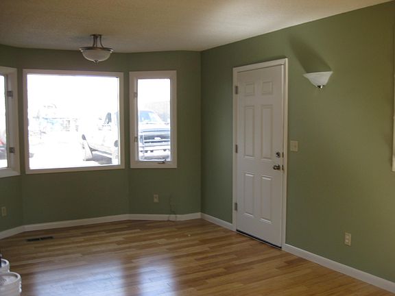 Living room with entry door from garage