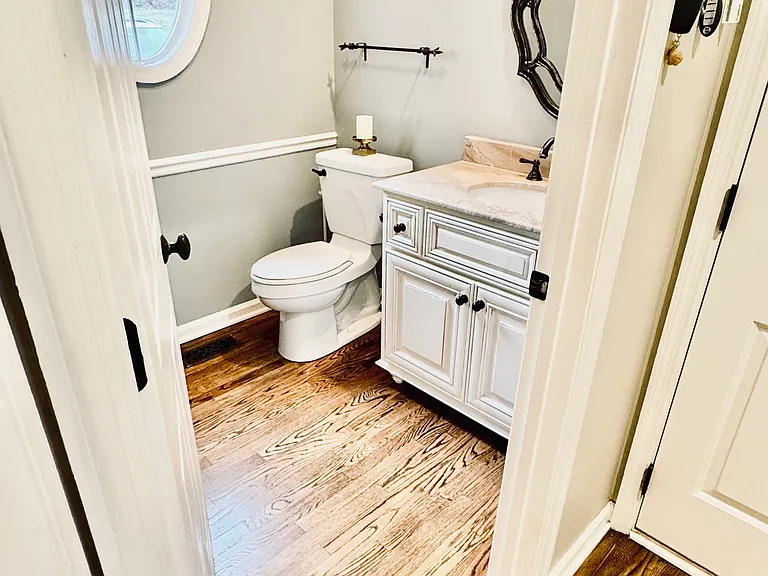 1/2 bath located after garage entrance