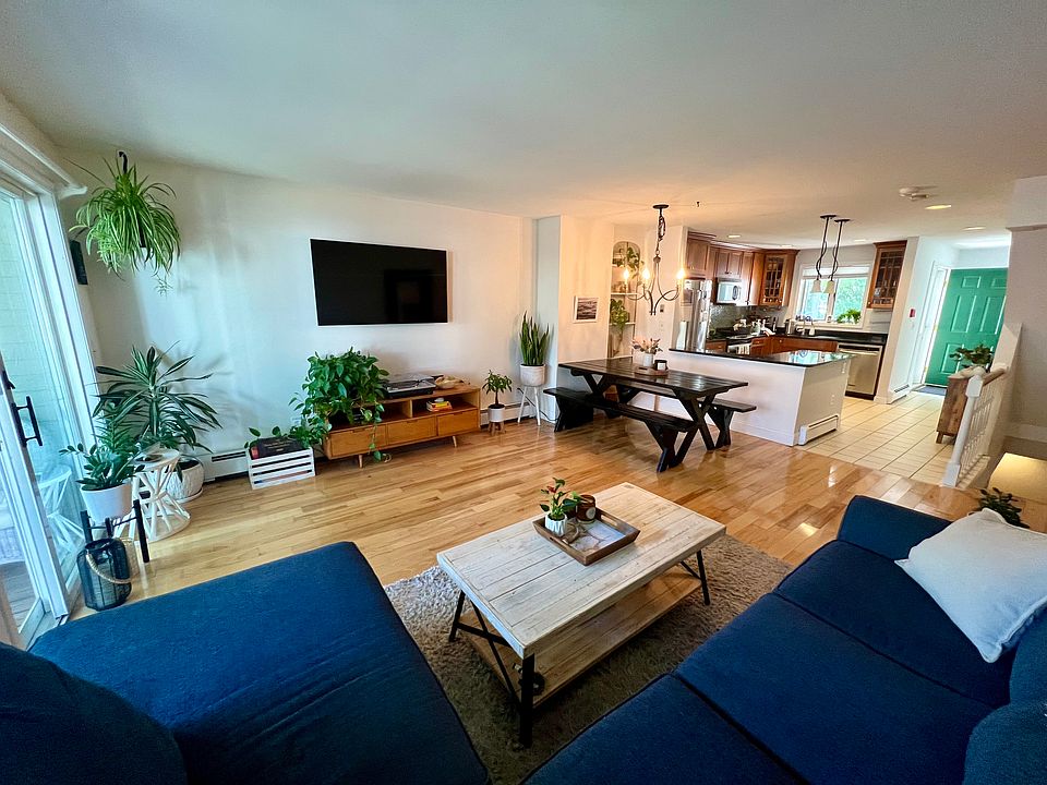 Open concept living room and kitchen with beautiful natural light