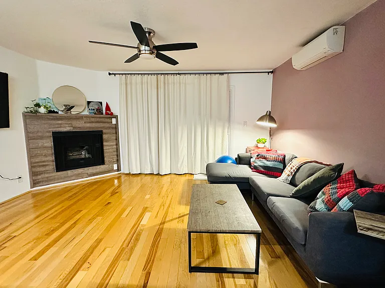 Living room w AC and fireplace