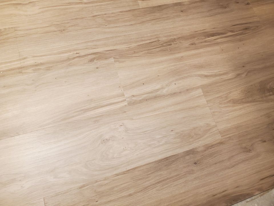 New "oak" flooring covers the downstairs areas.