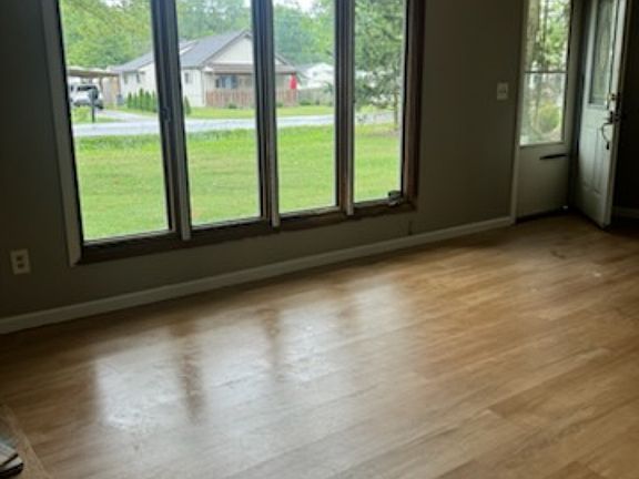 LIVING ROOM. ALL NEW PAINT BASEBOARD (WINDOWS SOON)