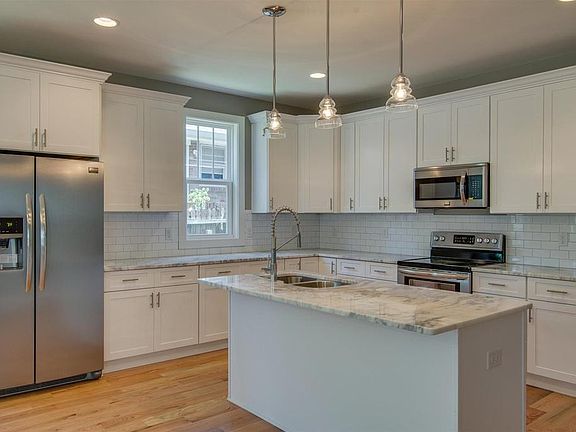 Stainless steel appliances and quartz countertops