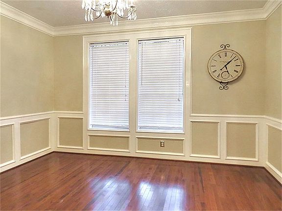 Formal dining with chair rail.