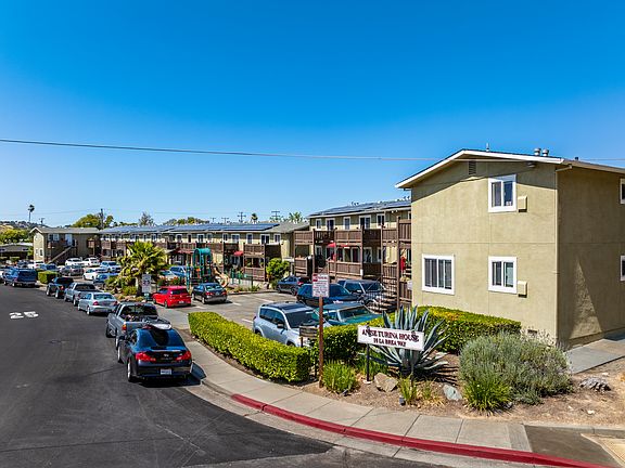 Welcoming community with convenient parking, vibrant landscaping, and easy access to nearby amenities.