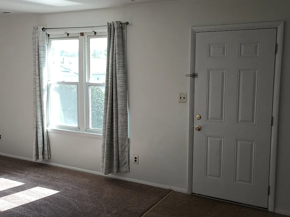 Living room showing entry door