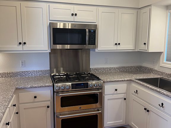 Kitchen - New microwave and newer gas double oven and range.