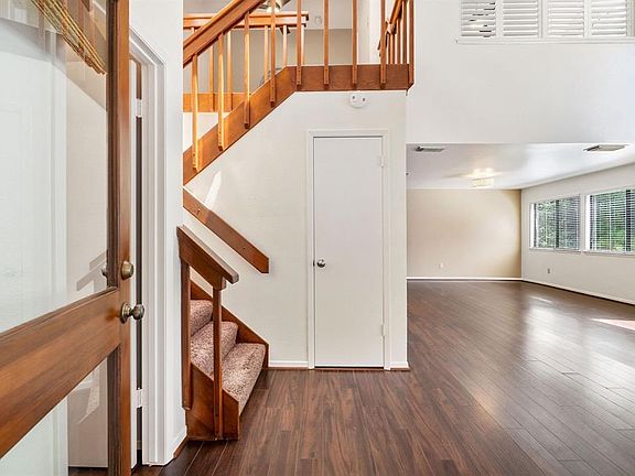 View from front entry.  Large storage closet under the stairs and half bath to the left.