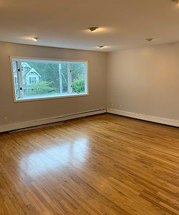 Livingroom area with huge bay window over looking mountain ave.