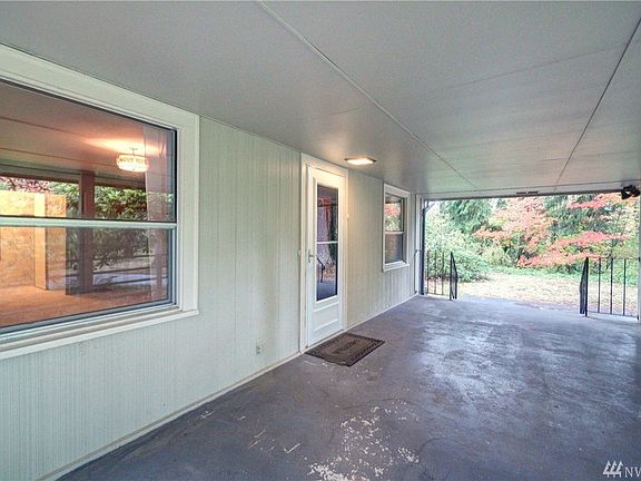 Large covered front porch has plenty of room for outdoor seating. 