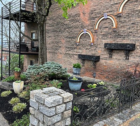 Entrance garden and city view decks. The 20' x 10' deck for the available 1 BR is the middle level of the 3 shown.