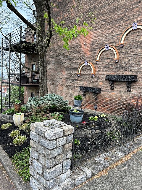 Entrance garden and city view decks. The 20' x 10' deck for the available 1 BR is the middle level of the 3 shown.