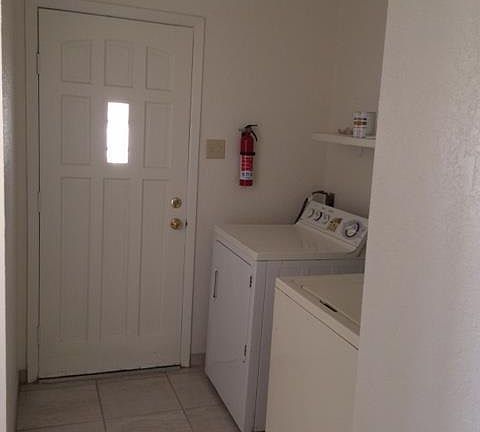 laundry room with door to backyard