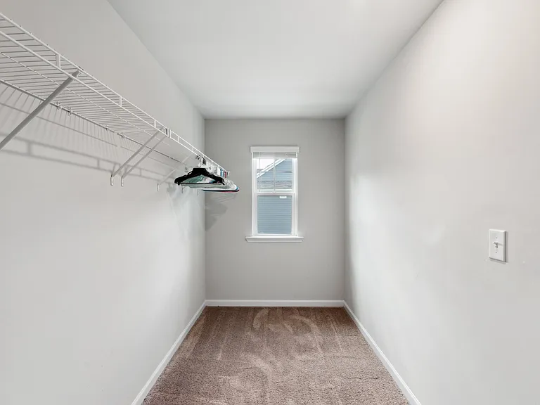Walk in closet off primary bedroom