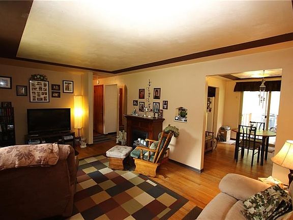 Large 19x11 Living Room w/ Gorgeous Original Re-Finished Hardwood Floors and Attractive Trayed Ceiling Design