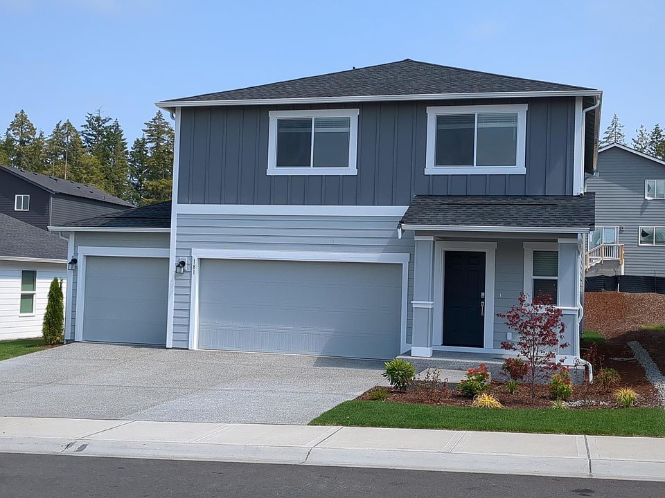 Front of the home. Fully landscaped front yard.